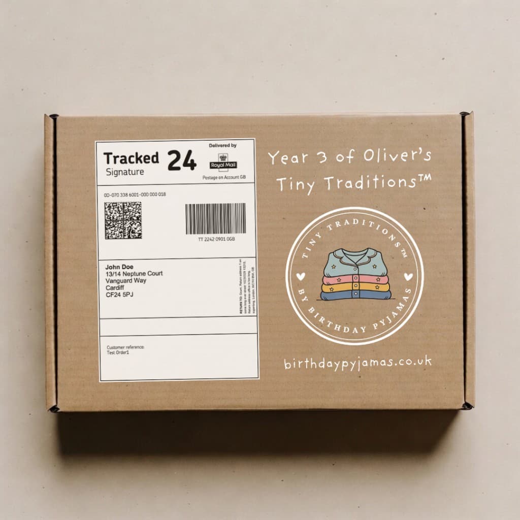 Tiny Traditions cardboard parcel with Royal Mail Tracked 24 label and personalised year branding
