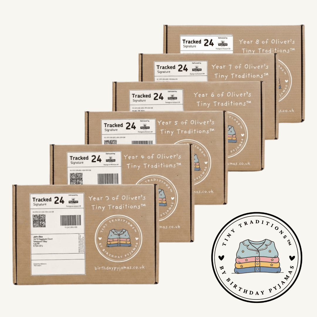 Diagonal stack of six kraft Tiny Traditions parcels, years three through eight, Royal Mail Tracked 24 labels, circular seal and birthdaypyjamas.co.uk on each box
